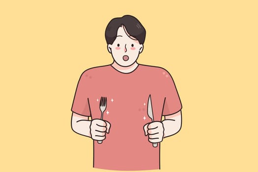 Hunger, appetite, surprise concept. Young hungry man cartoon character with knife and fork in hands standing feeling shocked with tasty meal vector illustration