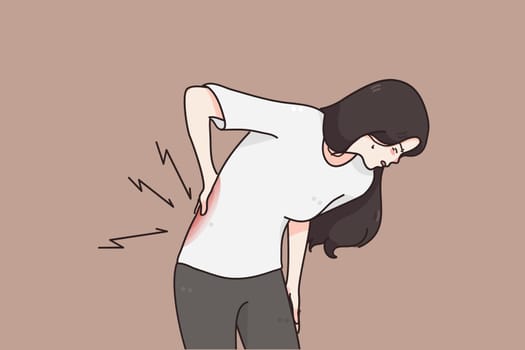 Suffering from Chronic back pain concept. Young woman standing holding her lower back suffering from unbearable pain vector illustration