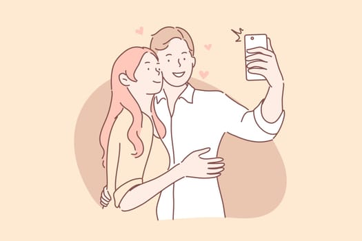 Couple in love take selfie concept. Boyfriend and girlfriend man and woman hug and makes photo or take picture on smartphone together. Couple in love takes joint selfie. Social media communication.