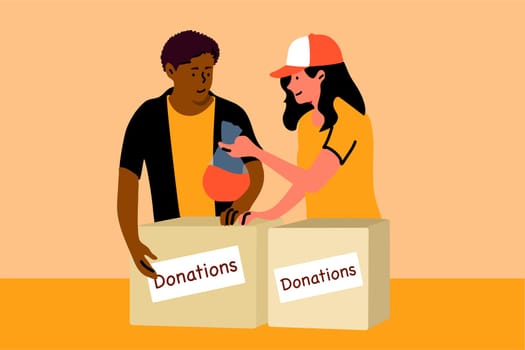 Support, charity, care, volunteering, help concept. Young smiling african american man boy woman girl volunteers standing with donation boxes with clothes food medicine supplies. Charitable foundation