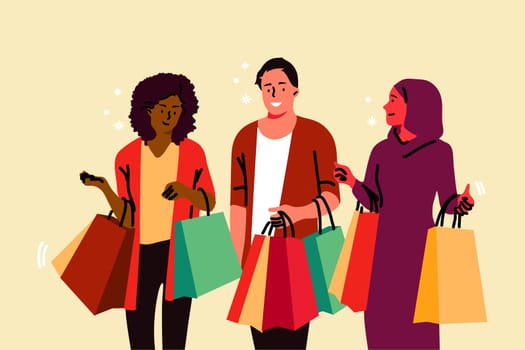 Shopping, hobby, friendship, commerce concept. Young happy smiling customers friends arabic african american woman muslim man boy walking together with shop bags from store. Leisure time recreation.