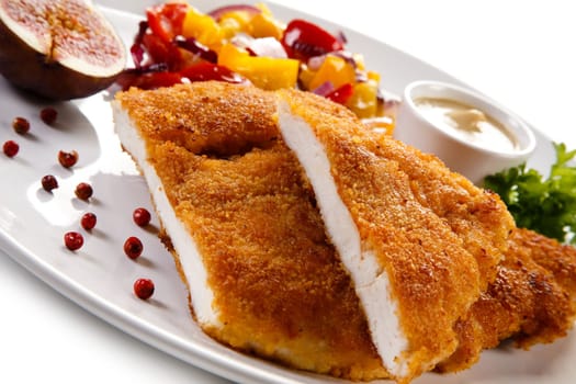 Fried pork chop coat in breadcrumbs and vegetable salad
