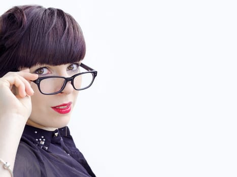 A dark haired intelligent young woman with glasses