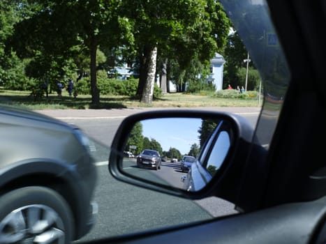 road in the car rearview mirror first person view