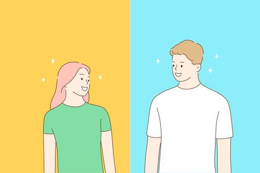 Friendship, positive emotion, young happy people concept. Smiling young man and woman looking at each other and feeling cheerful and excited over blue and yellow background