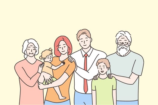 Family, portrait, motherhood, fatherhood, childhood, love concept. Happy father mother grandmother grandfather and children kids son daughter standing looking at camera. Three generations together.