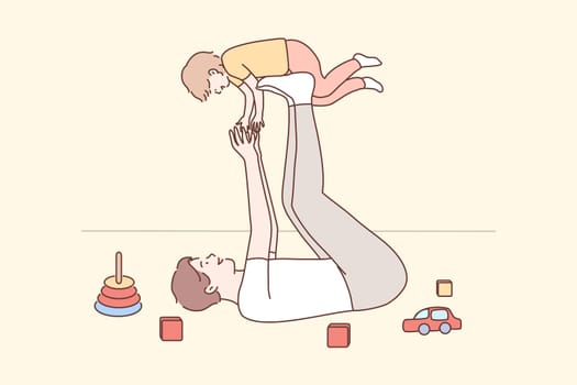 Family, fatherhood, childhood, play, recreation, leisure concept. Joyful young man dad lying on carpet floor lifting excited happy little child kid son at home. Having fun and fathers day illustration