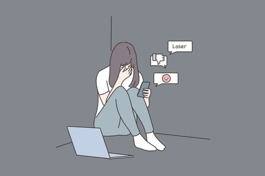 Depression, frustration, mental stress, media concept. Young derpessed frustrated woman girl teenager sitting on floor with smartphone reading messages. Suffering from cyberbullying in social network.