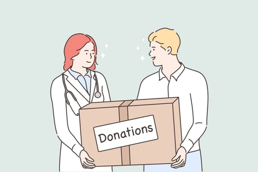 Medicine, health, help support, donation concept. Young man and woman doctor holding huge bog with donations medical face masks and treatment from viruses deseases. Humanitarian support or goodwill mission and intentional help.