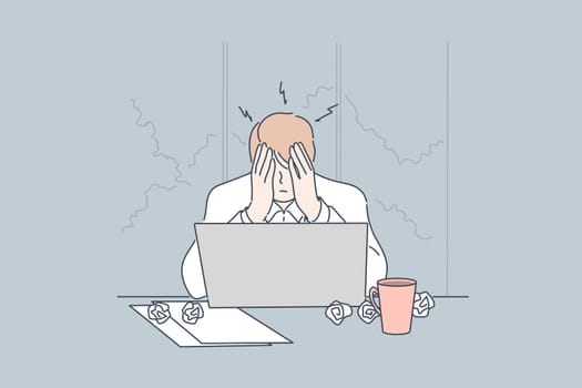 Stress, depression, frustration, overworking, fatigue business concept. Young frustrated depressed businessman, boy clerk manager sits on workplace at office. Mental work stress. Overworking, headache