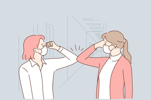 Protection from COVID-19 pandemic, healthcare and working during outbreak concept. Female colleagues in protective face masks greeting each other with bumping elbows at workplace vector illustration