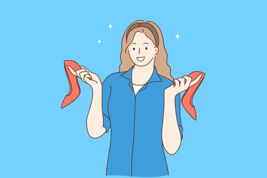 Fashionable red high heels shoes and glamorous footwear concept. Young pretty smiling woman cartoon character standing and holding pair of stylish red shoes in hands over blue background