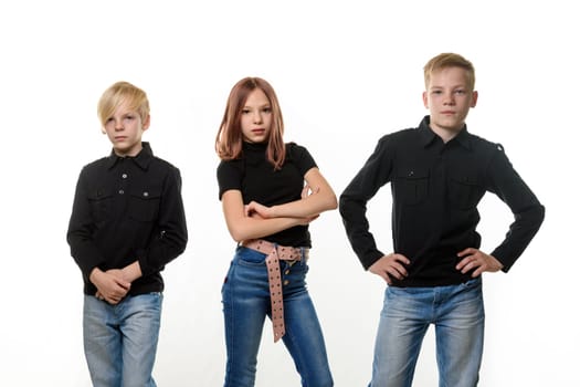 Portrait of teenagers - two boys and girls of European appearance in dark casual clothes on a white background