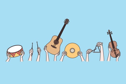 Musical instruments and creative arts concept. Human hands holding musical instruments guitar violin drums teangle over blue background vector illustration