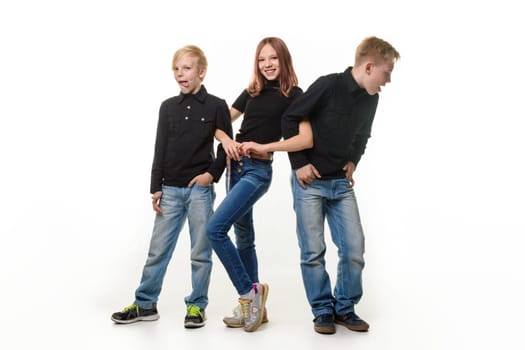 Happy girl surrounded by boring brothers who are disgusted
