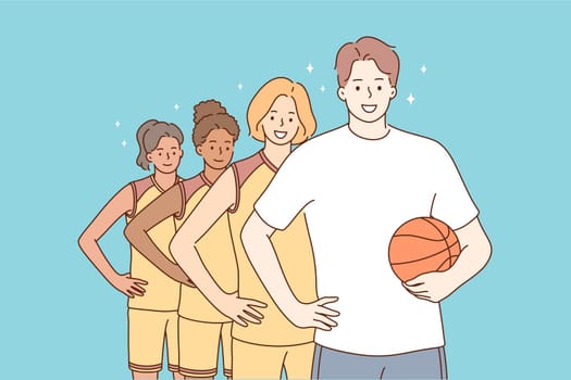 Teamwork, sport, basketball, portrait concept. Team of young happy smiling multiethnic women girls students teenagers players atheltes standing together with man guy coach character looking at camera.