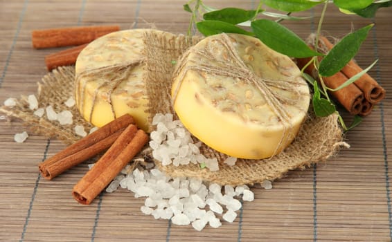 Hand-made soap and sea salt  on grey bamboo mat