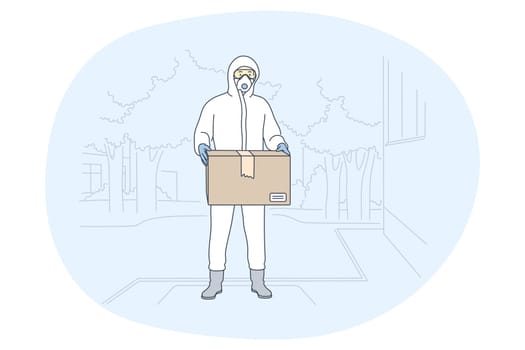 Contactless delivery, courier, online order concept. Man courier deliveryman in protective costume with mask delivering parcel to customer during epidemic of coronavirus. Parcel, logistics in pandemic