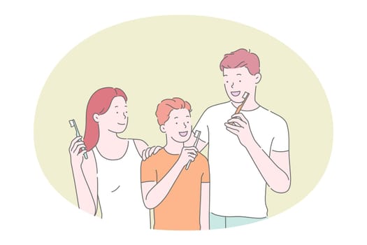 Brushing teeth and dental hygiene concept. Happy family with son cleaning teeth with toothpaste and toothbrush all together in bathroom. Morning routine for all family members