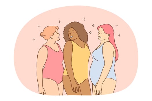 Overweight, plus size, obesity concept. Young smiling women friends of different ethnicities in colourful swimsuits standing and enjoying vacations together living active happy life