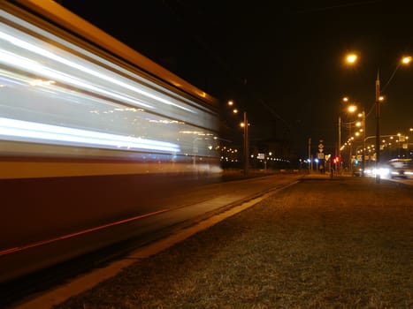 tram blurry motion  passing by at night, long exposure