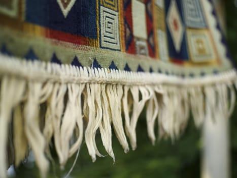 rug with fringe dries after washing close-up
