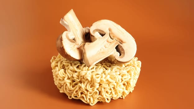 Asian instant noodles and mushrooms, traditional oriental food ramen and vegetables. fast food. The concept of vegetarianism. pasta, for the preparation of which it is enough to pour boiling water.