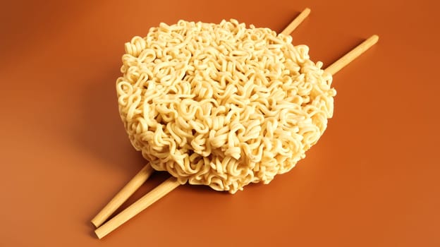 Raw dried instant noodles with chopsticks with copy space. Asian food. minimalism. pasta, for the preparation of which it is enough to pour boiling water and wait a few minutes. Vermicelli, spaghetti.