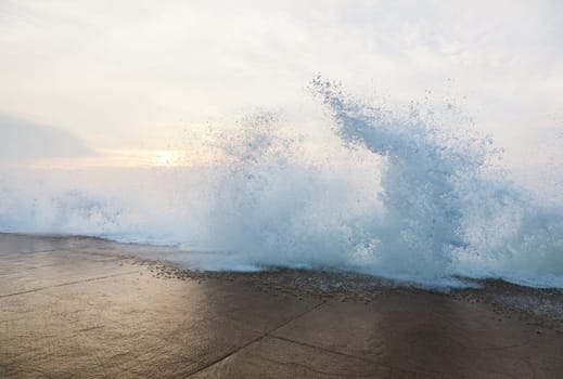 Splashing wave on dyke during high tide in Saint Malo, Brittany, France