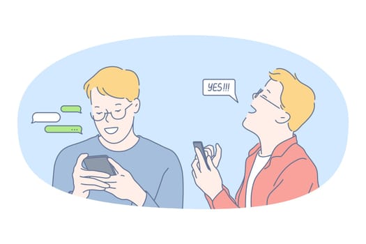 Smartphone, online communication, chatting concept. Young smiling man standing with smartphone in hands, chatting, searching information in internet, calling, dating or communicating online