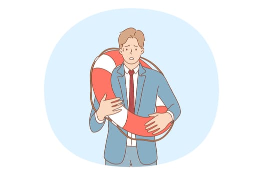 Business crisis, bankruptcy, failure in career concept. Young frustrated businessman cartoon character in suit standing in lifebuoy on body and feeling depressed vector illustration