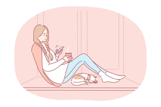 Comfortable relaxing at home with smartphone and hot drink. Young happy girl cartoon character sitting on windowsill with tea, chatting online on smartphone, enjoying rest at home near sleeping cat