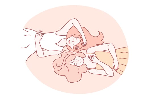 Woman beauty, relaxation, friends, sisters, summer concept. Young smiling girls teens with long hair in dresses cartoon characters lying on ground and having fun together, top view