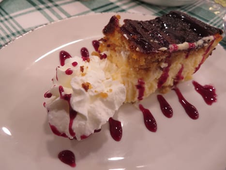delicious tasty cheesecake sweet whipped raspberry sauce
