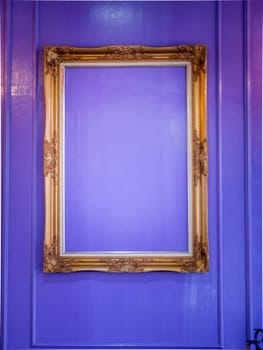 Vintage gold frame with ornament, white wooden background, free space for your design and home interior