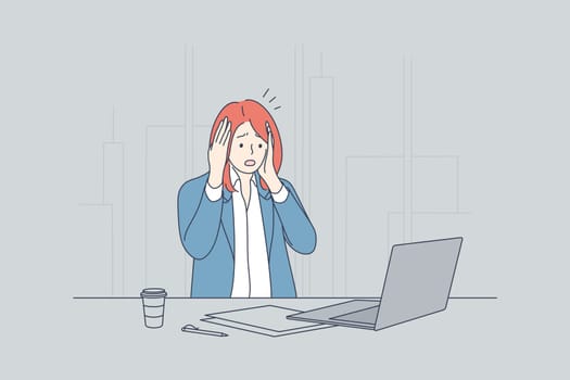 Frustration, depression, fear, business, overworking, deadline concept. Young scary frustrated frightened businesswoman clerk manager sitting at laptop holding head. Office overload and mental stress.
