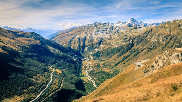 Scenic view of a switchback road through the mountains in Switzerland