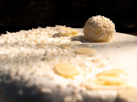 Celebratory cake with white cream and nuts. Birthday. Bakery products. Cooking Shop window. Place for text. Background image. Sweets.