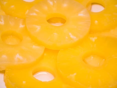 Sliced pineapple on a plate. Food photo. Place for text.