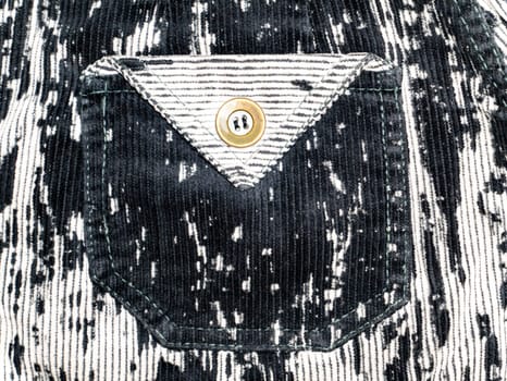 Pocket with button on velvet fabric. Background image. Place for text.