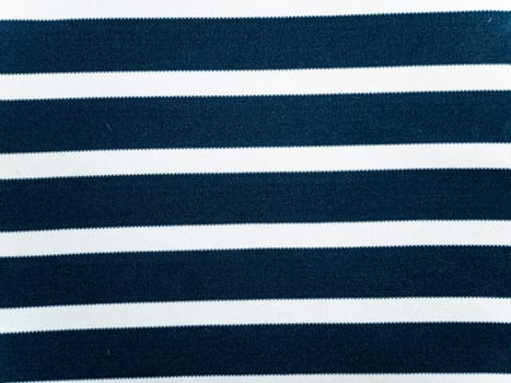 Texture of blue fabric with white stripes. Background image. Place for text.