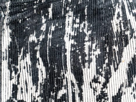 The texture of black and white velvet fabric. Background image. Place for text.