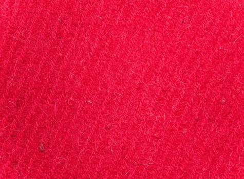 Texture of red woolen knitted fabric. Background image. Place for text.