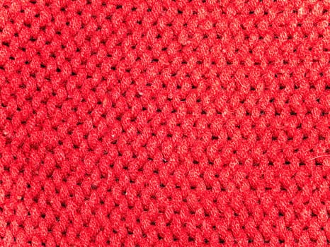 Texture of red woolen knitted fabric. Background image. Place for text.