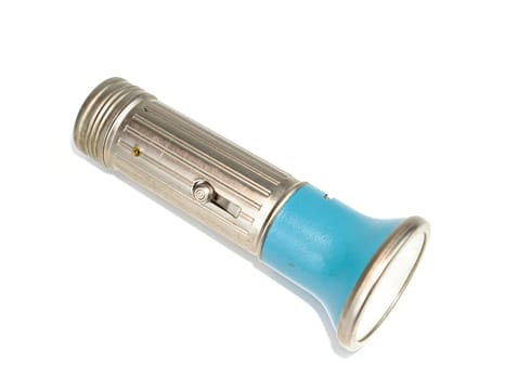 Pocket flashlight in a metal case on a white background. Retro. Technology. Place for text. Background image.