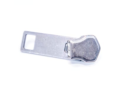 Zipper slider on a white background. Place for text. Free place. Macro photo.