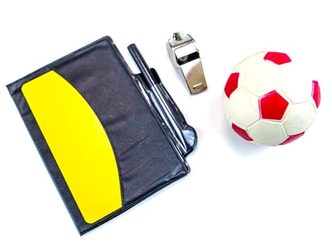 Soccer ball and yellow card with the whistle of a soccer referee on a white background. Football. Championship. World. Europe. Referee. Place for text.