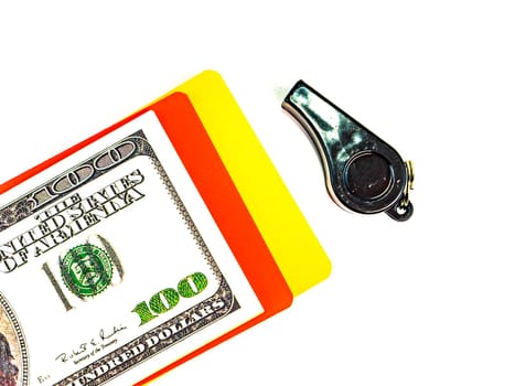 Warning cards and money of a football referee.. Corruption of a football referee for money. Money. Soccer referee cards. Sport. Tote. Bribe. Rates. Bribe. Place for text. Euro currency. Dollar.