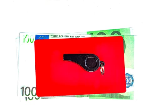Warning cards and money of a football referee.. Corruption of a football referee for money. Money. Soccer referee cards. Sport. Tote. Bribe. Rates. Bribe. Place for text. Euro currency. Dollar.