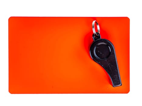 Red card and whistle of a football referee on a white background. Football. Championship. World. Europe. Referee. Place for text.